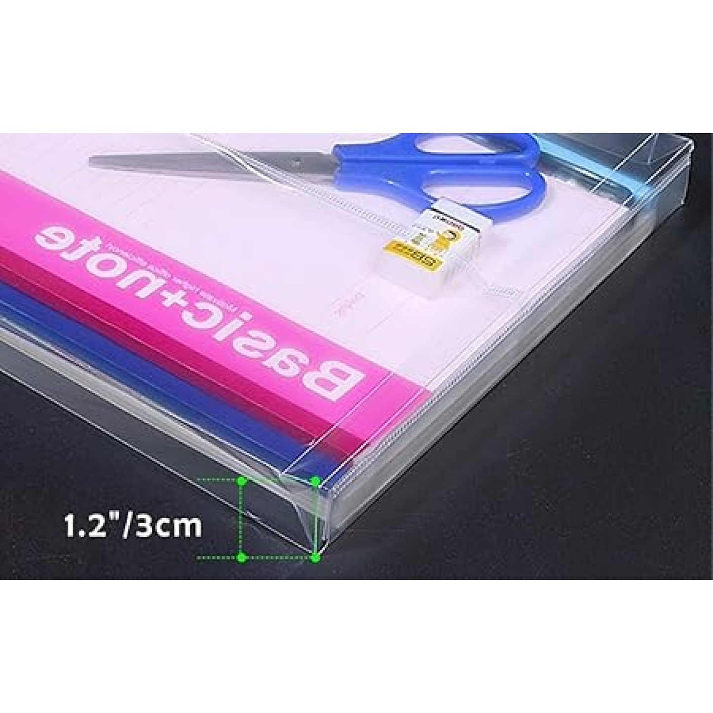 Transparent document folder with a 3 cm (1.2 inch) spine, holding notebooks, scissors, and eraser